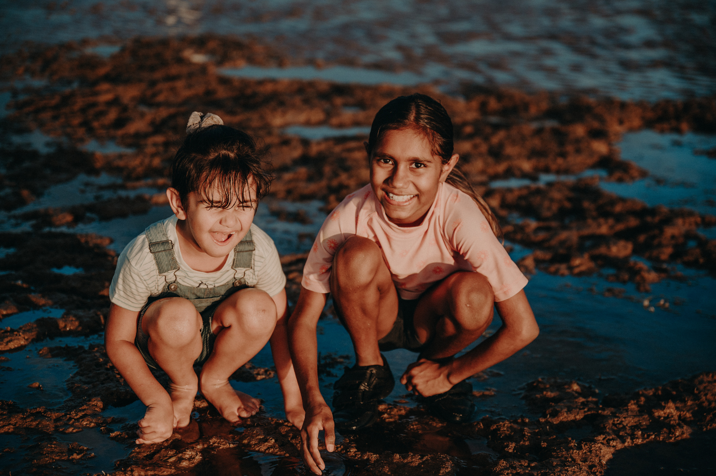 Two Happy Girls Playing at the Beach